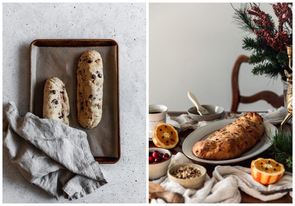 Two images. On the left, an overhead of a sheet pan topped with two stollen loaves halfway covered with a linen on a white speckled counter. On the right, a side image of a white oval dish with a baked stollen on a wood table next to a white gauzy linen, a vase of pine branches and winter berries, halved oranges, and bowls of ingredients with a wood chair and white wall in the background.